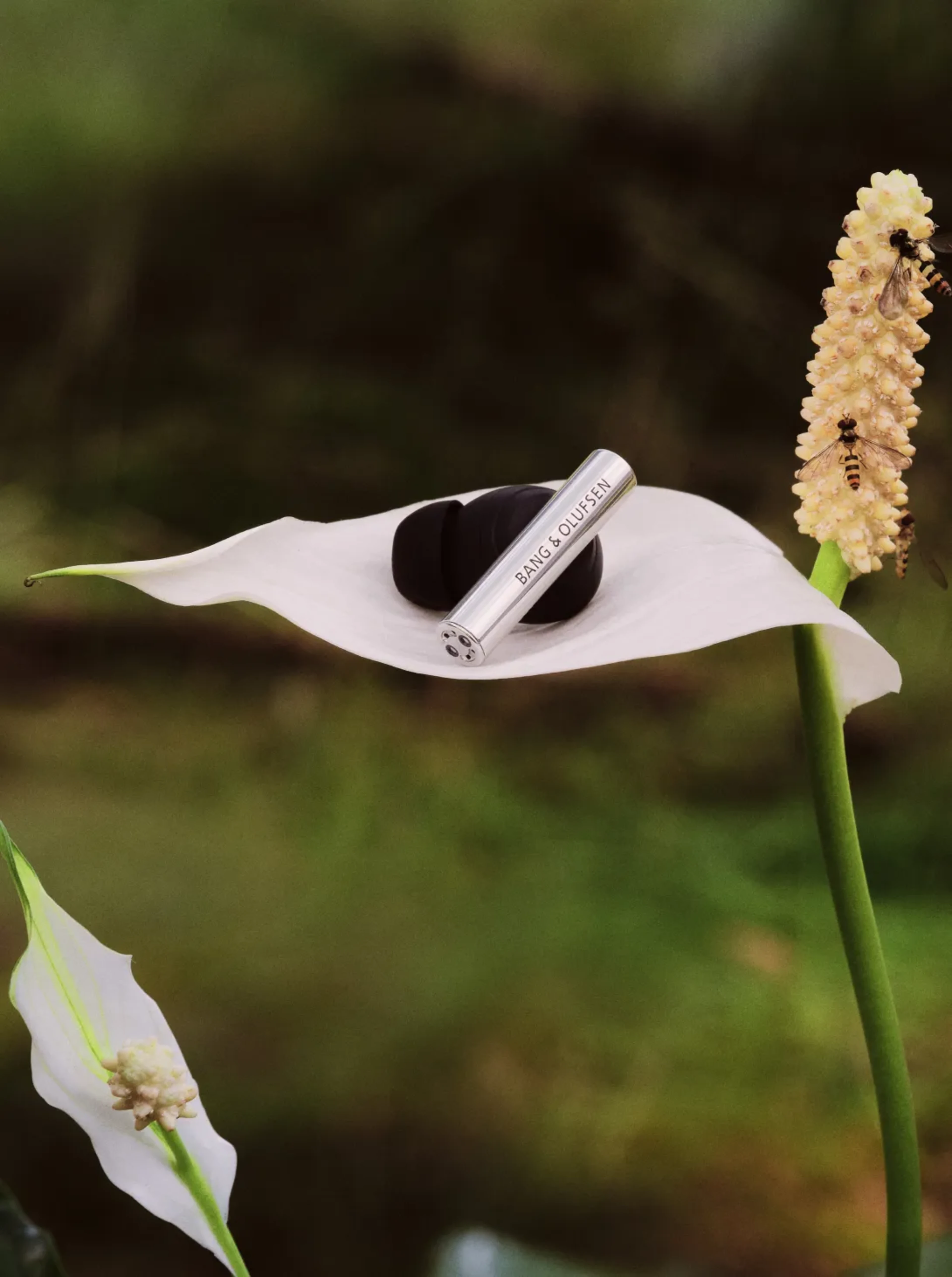 Super Hoodie earphone on a big flower leaf showing how light it is